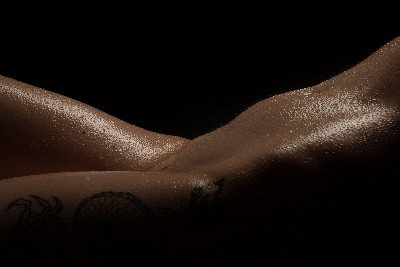 Fine art nude portrait close-up emphasizing texture and light
